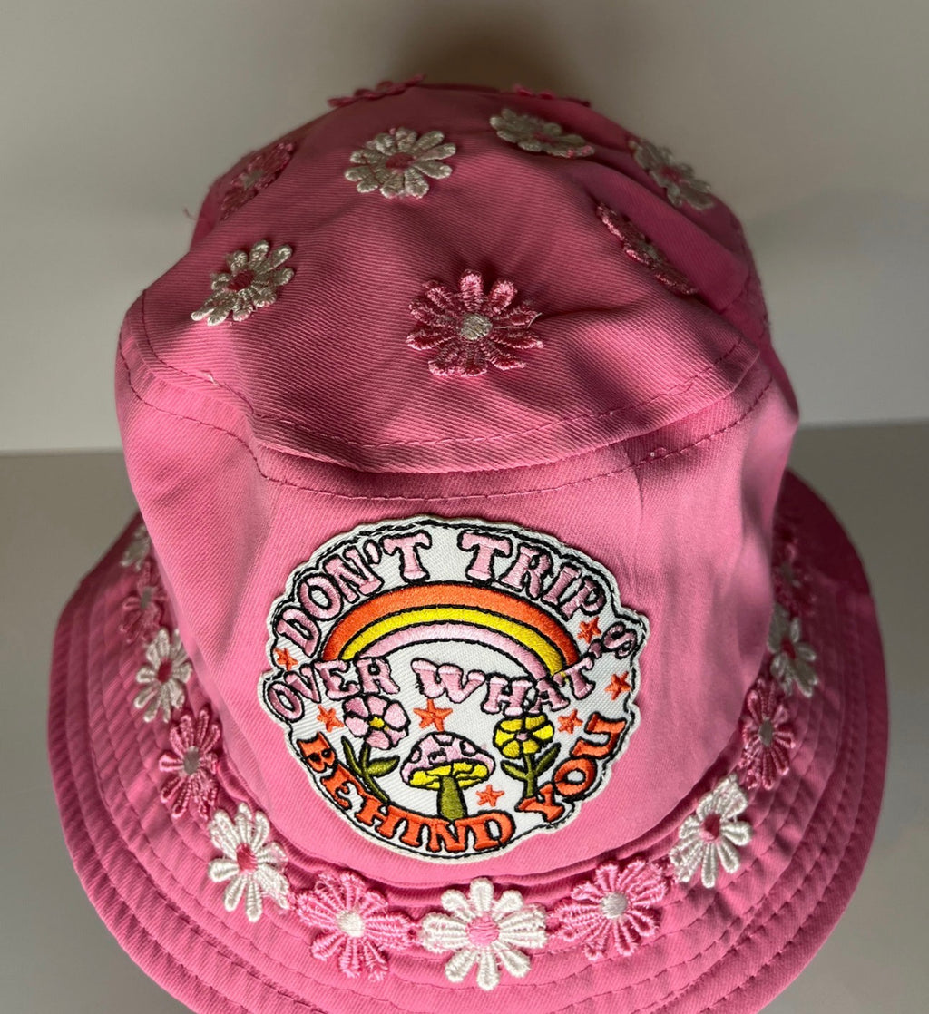 DON’T TRIP OVER WHATS BEHIND YOU BUCKET HAT