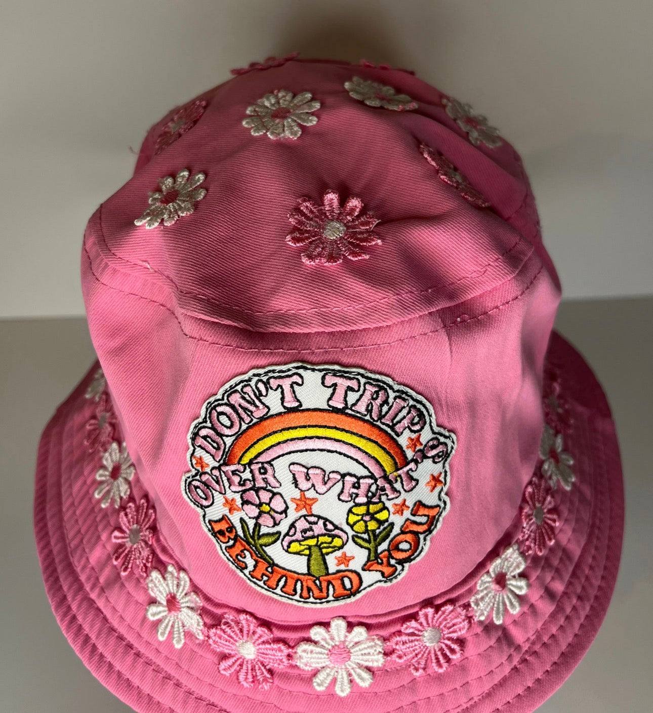 DON’T TRIP OVER WHATS BEHIND YOU BUCKET HAT